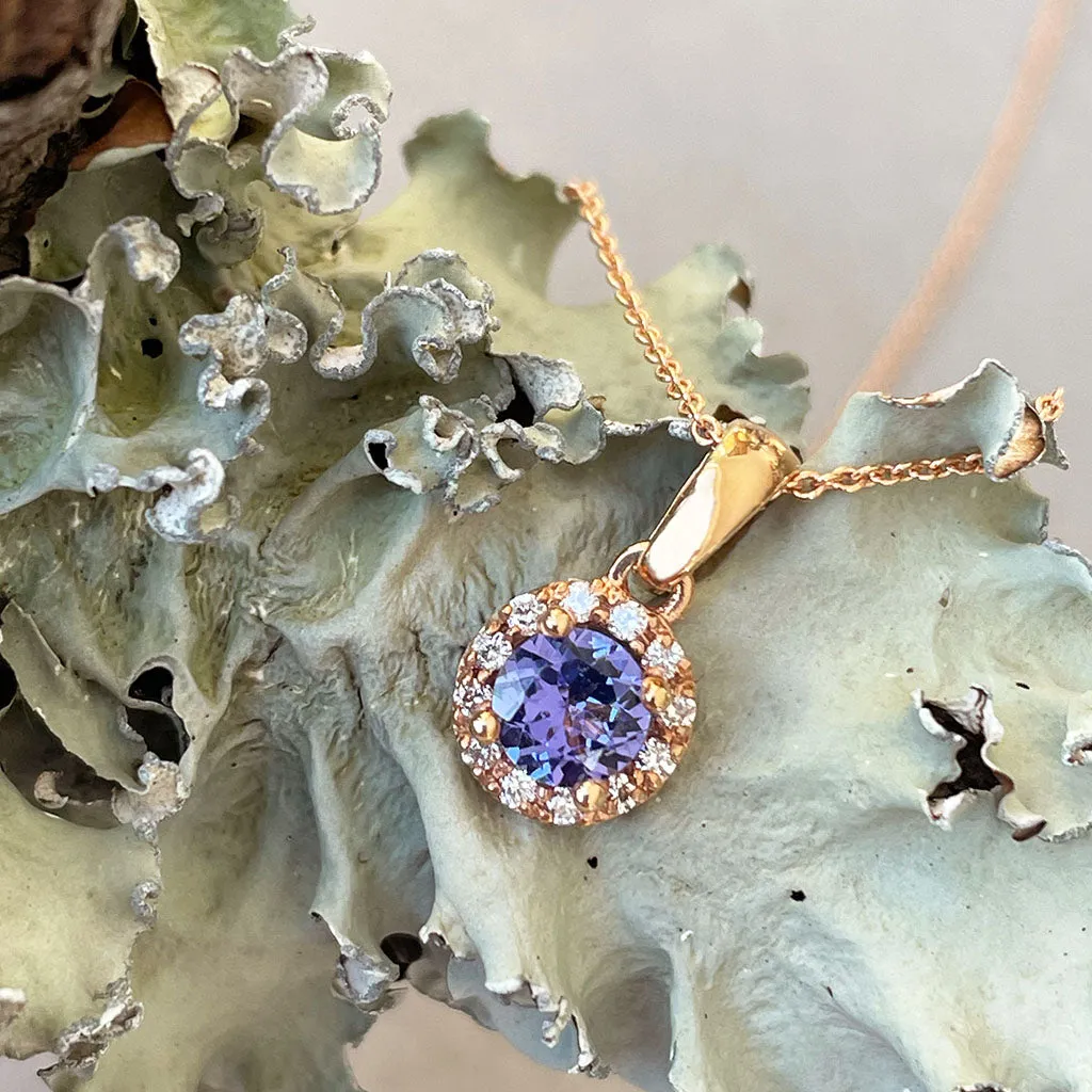 Elevated Tanzanite and Diamond Halo Pendant in Rose Gold