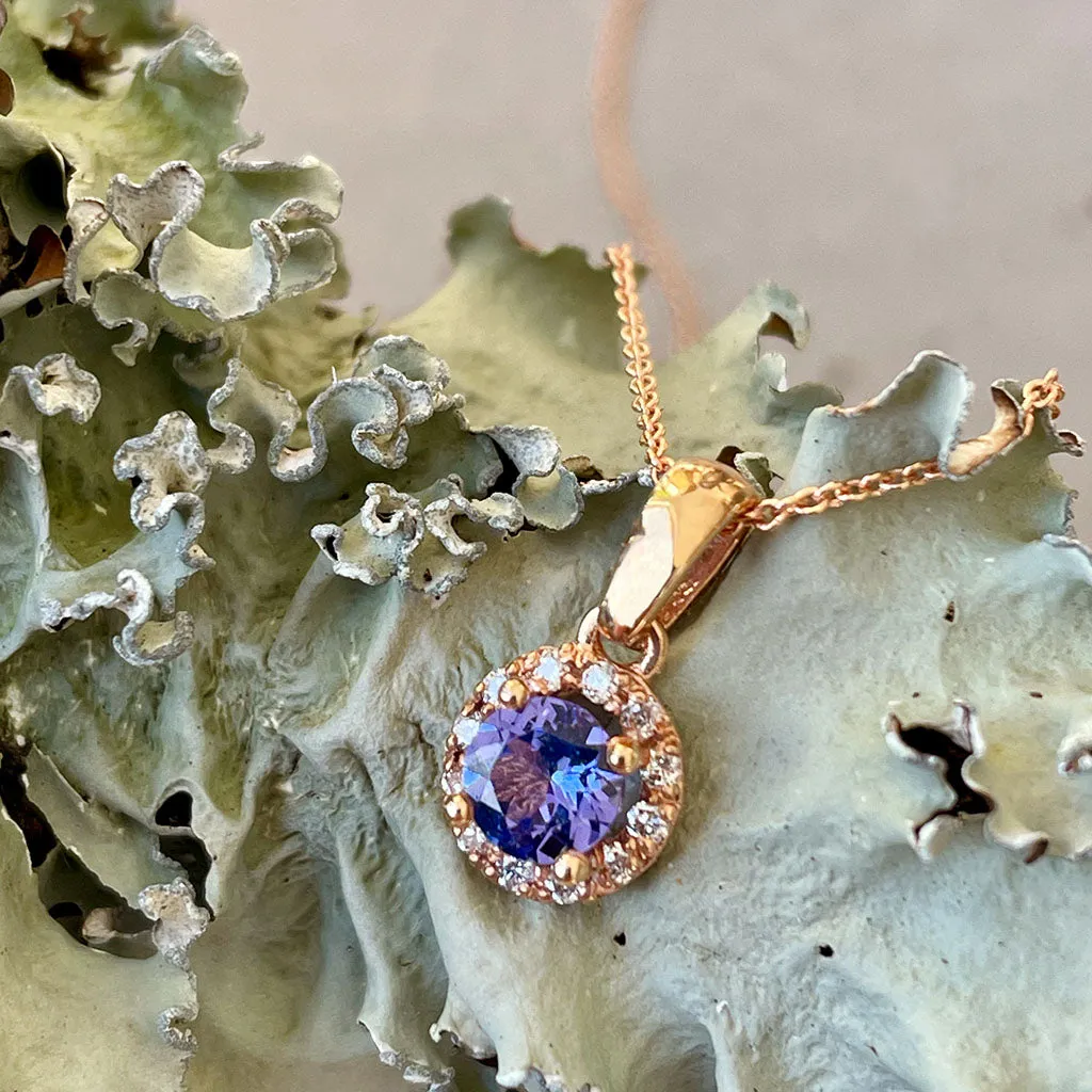 Elevated Tanzanite and Diamond Halo Pendant in Rose Gold